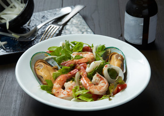 Yum Thai ocean seafood salad serve with soft drink set up.