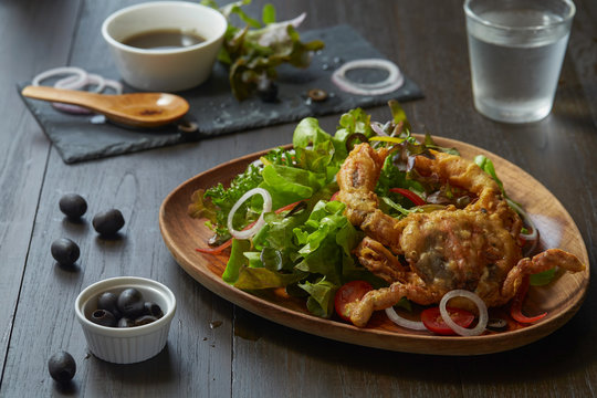 Caesar salad thai style with soft-shell crab serve with vegetable.