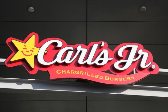 Tilst, Denmark - October 14, 2018: Carl's jr logo on a wall. Carl's jr is an American fast food restaurant chain operated by CKE Restaurant Holdings, Inc