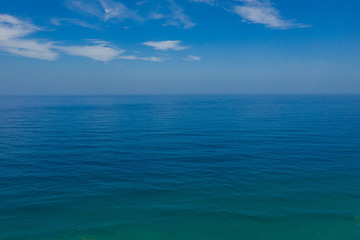 Fototapeta premium Light reflection on sea surface looking towards horizon View of horizon at Atlantic ocean at Fuerteventura, Canary islands, Spain. Aerial drone view
