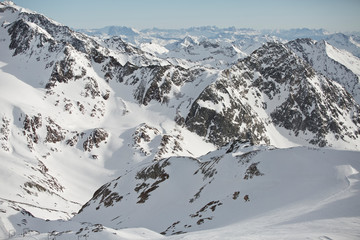 Obraz premium Austrian Mountains in the Alps of Tyrol. Alpine Winter landscape and mountain panorama in Europe. Glacier Stubaier Gletscher Skiing area near Innsbruck. Dolomites view