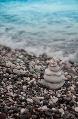 Fototapeta na wymiar Sea beach, blue waves and grey stones
