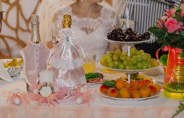 Beautiful candles on the table for the newlyweds on their wedding day.