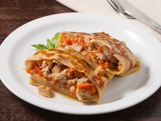 hearty pancake with chicken onions and carrots