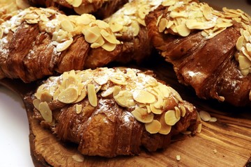 French croissants with almond flakes and icing sugar