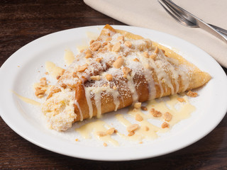 pancake with condensed milk nuts and coconut shavings