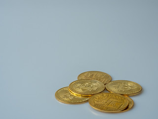 The pile of the Bitcoin Crypto currency is placed on the white background.