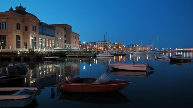 Old fishing boats in Bari at sunset, Italy