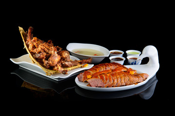 Peking duck on a black isolated background
