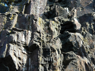 old cracked granite stone in winter