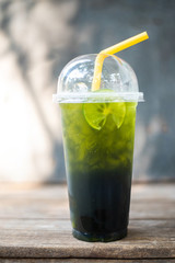 Green tea lemon on grey background.