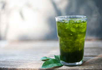 Green tea lemon on grey background.