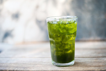 Green tea lemon on grey background.