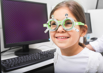 Little girl with special glasses receives treatment for her eyes. Amblyopia treatment....