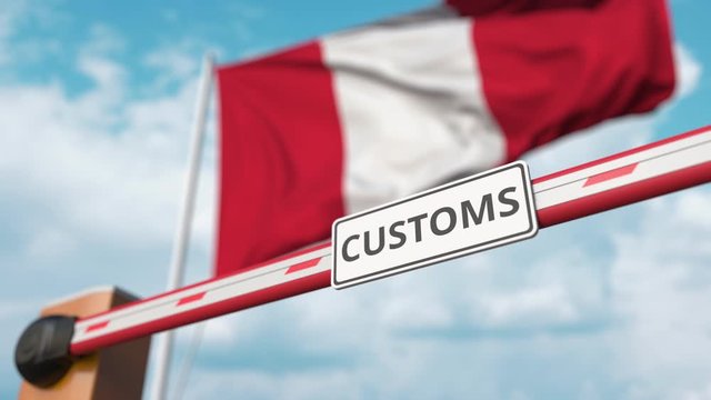 Closing boom barrier with CUSTOMS sign against the Peruvian flag. Border closure or protective tariffs in Peru