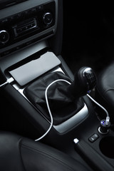 Mobile phone, smartphone charge battery, charging in the car plug close up