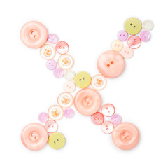 Letter X from pink and green buttons isolated on white background. Sewing kit. Colorful buttons, stylish alphabet for handmaking hobby. Handmade sew abc. Text from buttons