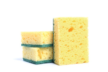 A yellow kitchen sponge isolated against white background in different poses.