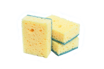 A yellow kitchen sponge isolated against white background in different poses.