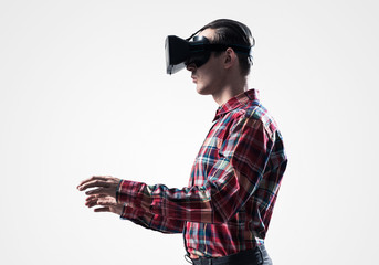 Guy in mask experiencing virtual reality as new entertainment device