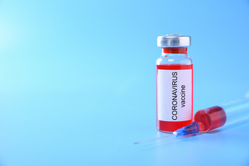 Coronavirus vaccine shot Covid 19 for baby vaccination on blue background, medicine and drug concept