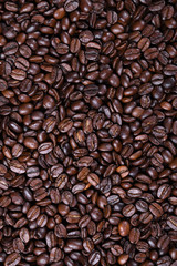 Fresh brown coffee beans texture of roasted ready to drink close-up.