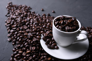 Coffee cup and beans on old grey kitchen beton , rock table. Top view with copyspace for your text