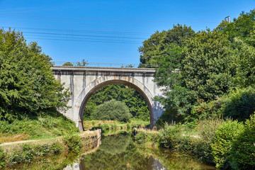 Fototapeta na wymiar Image of a railway bridge over Canal D'Ille et Rance, Brittany, France