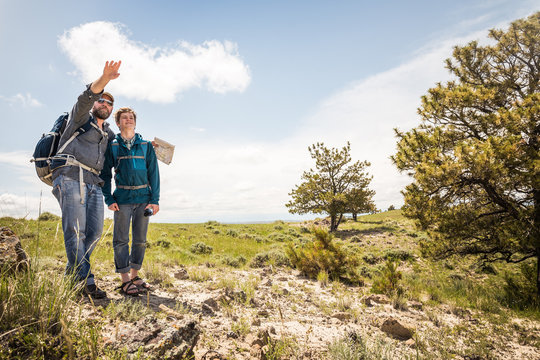 Father And Son Hiking In Rural Prairie Landscape. Cody, Wyoming, USA