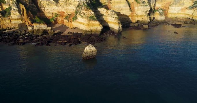 Aerial revealing view of the Camilo and D. Ana beaches in Lagos, Algarve, Portugal