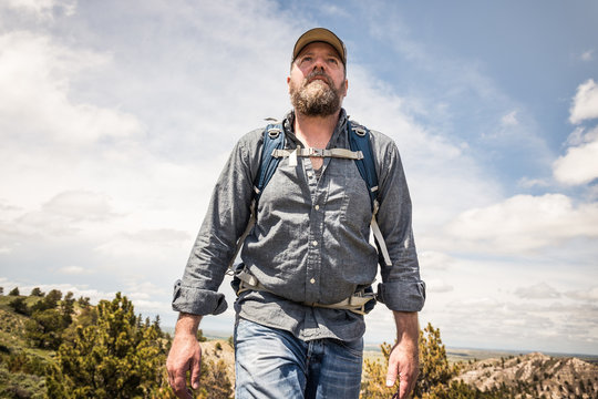 Man Hiking In Rural Prairie Landscape. Cody, Wyoming, USA