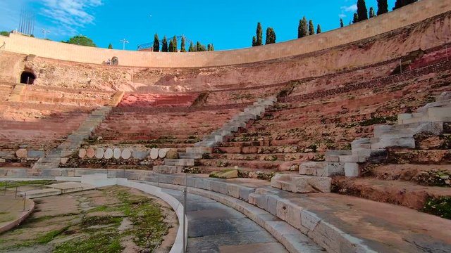 Roman Amphitheater in Cartagena Reveal, Rapid Pan Right. Sunny Day.