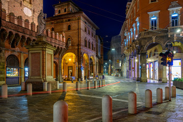 Old narrow street in Bologna, Emilia Romagna, Italy. Architecture and landmark of Bologna. Night cityscape of Bologna. © Ekaterina Belova
