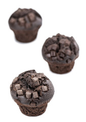 Some Chocolate Muffins isolated on white (selective focus)
