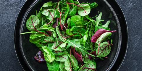 Fotobehang Healthy salad, leaves mix salad (mix micro greens, juicy snack) keto or paleo menu recipe. food background - copy space © Alesia Berlezova