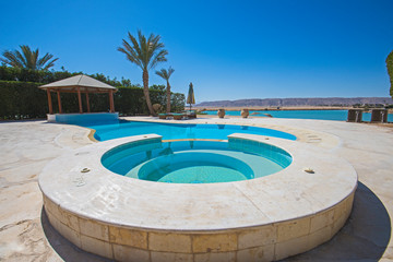 Swimming pool at at luxury tropical holiday villa resort
