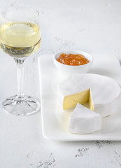 Camembert cheese with glass of wine