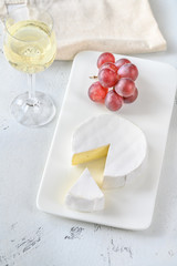 Camembert cheese with glass of wine