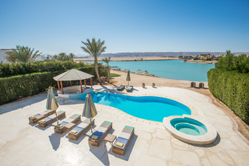Swimming pool at at luxury tropical holiday villa resort