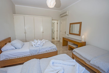 Fototapeta na wymiar Interior design of triple bedroom in house