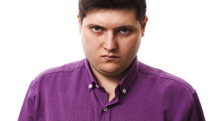 full man in violet menacingly looks at the camera on a white background copy space isolate