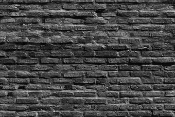 The background of the black and white grunge old brick wall in the house or any building. 