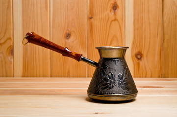 Copper cezve for brewing tasty and aromatic coffee on an open fire.