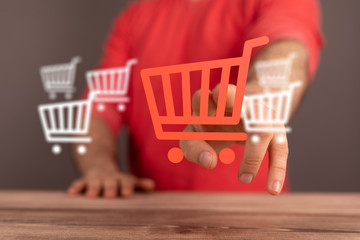 Businessman pressing modern technology panel shopping cart web phone credit card.