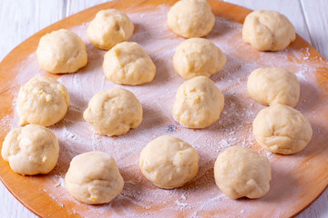 Fototapeta na wymiar Slices of raw yeast dough