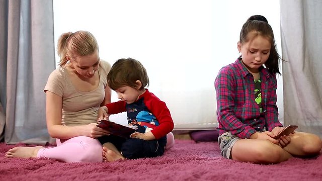 Sibling relationship. Quarrels of the brother and sister. Jealousy in the family. Older child. The mother scolds the child. The jealousy of the child. The parents pay little attention to the 
