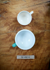 Empty coffee cup with march block