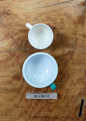 Empty coffee cup with march block