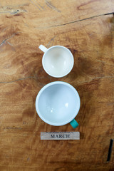 Empty coffee cup with march block