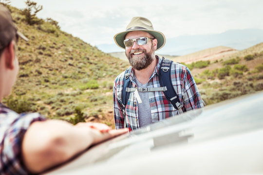Father and son hiking in a rural prairie setting. Bridger, Montana, USA